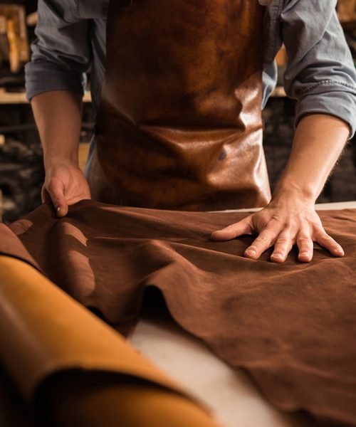 close-up-of-a-cobbler-working-with-leather-textile-resize.jpg